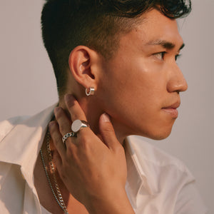
                  
                    Load image into Gallery viewer, Ivan wearing LOUPN Mirror Signet, Cuban Chain Ring with Solid Hoop Earrings 
                  
                